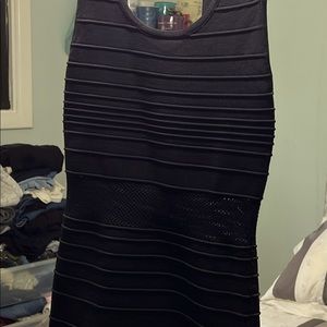 Nylon rayon form fitted mini dress with see through waistline.